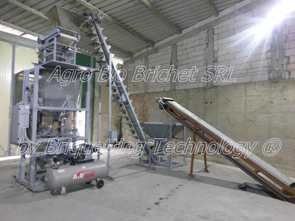 Automated bagging system for sawdust pellets