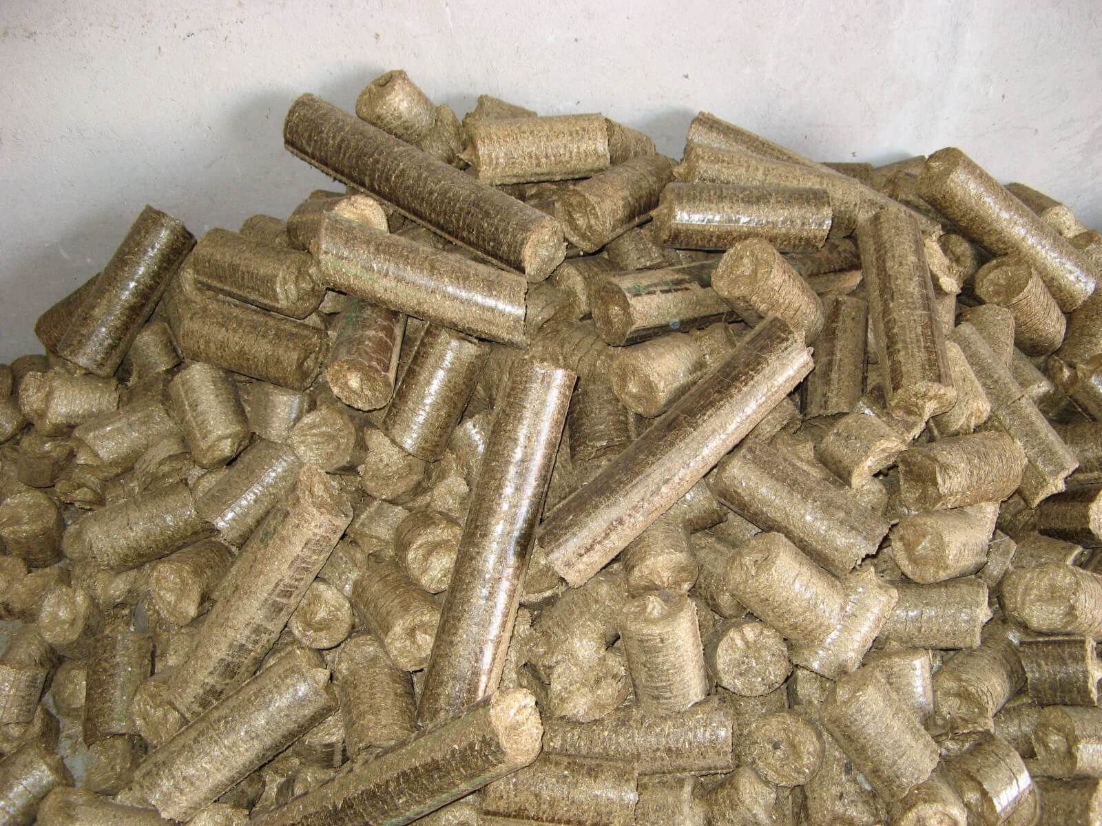 Straw briquettes being manufactured